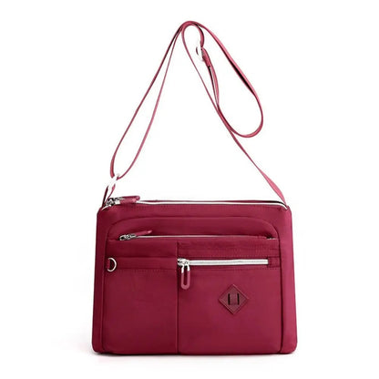 Eleganza™ - Cartera de mano multifuncional